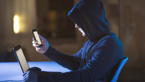 hackers with laptop and smartphone